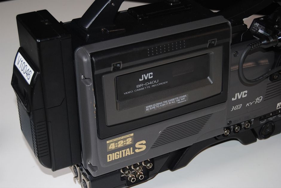Vintage JVC BR-D40U DIGITAL S 4:2:2 Recorder with Camcorder D9 Video Camera.
The BR-D40 offers all the high quality of Digital-S in a convenient dockable configuration. It docks not only to JVC cameras, but to other manufacturers' cameras as well.

Perceptually loseless, high picture quality with 3.3:1 compression, and 8 bit 4:2:2 component digital recording. DTV, 16:9 ready.

104 minute recording time

Color playback with 10X picture search

2 time code reader-generators with jam sync and external lock.

Specifications

Format: DIGITAL-S

Tape width: ½ in.

Tape speed: 57.737mm/s

Video signal system: Component digital signal with Digital-S compression (DCT based)

Timecode: based on SMPTE 12M

Dimension: 247 x 253 x 142mm (tentative)

Weight: less than 3.5kg (tentative)

Power consumption: Less than 1.6A (tentative)

Power requirement:

12 V DC

11 V to 15 V DC (permissible voltage range)

Maximum voltage: 17 Volts DC (less than 5 min.)

Recording/PB time: 124 min. (with DS-104 tape)

FF/REW time: approx. 4 min. (with DS-104 tape)

VIDEO

Input:

Camera (50 pin) component

Y:1/R-Y,B-Y:0.7Vpp,75 ohms unbalanced

Output: Composite (BNC) 1.0Vpp,75 ohms unbalanced

External sync input: none

AUDIO

Inputs

Camera (50 pin): -20dBs, 3k ohms, balanced X2

Line (XLR): -60/+4dBs, 10k ohms/3k ohms , balanced X2

Outputs

Line: -6dBs, low-impedance, unbalanced X2

Headphone: -17dBs, low-impedance

Number of PCM tracks: 2

Number of cue tracks: 2

PCM Frequency Response: 20~20,000Hz +1/-1.5dB

PCM Dynamic Range: more than 85dB

Wow & Flutter: less than measurable limit

Timecode(LTC only)

Input: 0±6dBs, high-impedance, unbalanced

Output: 0±6dBs, low-impedance, unbalanced





DIGITAL-S Highlights

4:2:2 Component Digital Processing

DIGITAL-S's outstanding picture quality is derived from 4:2:2, 8-bit component processing that assures the highest resolution and color detail even over multiple generations. Horizontal resolution for the system is 720 pixels or 540 TV lines. To maintain the best possible image quality in multi-generation editing and digital search, the compression ratio is set to a very mild 3.3 to 1 with DCT-based intra-frame coding and a data recording rate of 50 Mbps. The combination of these specifications with wide-band component recording enables DIGITAL-S to reproduce the finest color details and subtlest contrasts of an image while minimizing artifacts.



Video Pre-Read

Video pre-read (BR-D85U only), never before available on a system in this price range, enables the recorder to first play back the digital signal on the tape, modify it with an external device, then re-record the modified signal in its place. It's a capability that allows an A/B roll system to be built with only two VTRs instead of three, saving the cost of one VTR. In addition, video pre-read allows complex layering effects to be performed even when working with a simple switcher with only one mix/effects bank. For multiformat editing, adding just one high quality DIGITAL-S recording deck with pre-read will provide virtually lossless editing, which means your finished tape will look like your original source footage. No other upgrade or addition to your current editing suite can provide such a dramatic increase in video picture quality.



Recording Time

High-resolution DIGITAL-S signals are captured and preserved on a high-density 1/2-inch tape featuring an advanced metal particle formulation based on W-VHS HDTV technology. Tape speed is 57.8 mm/s with a maximum recording time of 104 minutes. The cassette dimensions are the same as those of VHS. However, the cassette housing features a newly developed dust-proof cover and cannot be loaded into conventional VHS decks.



Digital Sound

DIGITAL-S's audio specifications are just as impressive. Two independently editable, 16-bit PCM (pulse code modulation) signals can be recorded with a sampling frequency of 48 kHz, ensuring audio quality equal to today's most exacting standards. 2 linear cue tracks mirror the digital audio channels for effortless audio scrubbing and cueing.



Editing Facilities

The advanced capabilities of JVC's DIGITAL-S bring a new world of powerful editing features to your edit suite. Editing features include video pre-read (BR-D85U only), 2 independent time code reader/generators built in with VITC/LTC built-in time code recording. Independent editing of video, TC, or either channel of PCM audio is possible. A versatile range of search functions available via the jog/shuttle controls allow footage to be viewed in color at speeds of up to ± 32x Continuous, noiseless slow-motion playback is also available within a range of ± 1/3.



Self-Diagnosis

Thanks to the RS-232C interface, you can check the VTR's operating condition without interfering with operation. When the request command is sent via the 232C interface, diagnostic checks are run for head clogging, error rate, etc.



Genlock/TBC Adjustment

System phase, SC phase and video phase can be adjusted on the front panel while video level, chroma phase, chroma level and setup level can be adjusted remotely via the 15-pin D-SUB connector provided on the rear panel.



Slow Motion

Slow-motion field or frame playback is menu-selectable.



On-Screen Menu

To permit easy access to a full array of professional functions, DIGITAL-S VTRs incorporate an on-screen menu. Menu data is superimposed on the video monitor output. This menu system allows you to set 50 items while referring to the counter or on-screen display. Besides reducing the number of external switches, this system lessens the chance of function settings being accidentally switched on or off as is possible with external switches. A full set of LED indicators on the front panel assure you that the desired functions are engaged. On-screen mode check and warning indications are also provided. And, since the menu system is hierarchical, pressing one of the Direct Menu Access buttons allows you to go straight to the desired menu.



Systems Flexibility

JVC's new DIGITAL-S recorders are designed for easy incorporation in any existing edit suite. Interfaces are provided for analog composite, Y/C, and component signals. Serial digital video interface (SMPTE259M and AES/EBU digital audio) is also available as an option.



Drum Structure

To ensure DIGITAL-S/S-VHS mode compatibility, the drum structure features an upper stationary drum, a middle rotary drum and a lower stationary drum. (A conventional drum, on the other hand, consists of an upper rotary drum and a lower stationary drum.) Recording and playback heads on the middle drum make stable tape movement possible even at 4,500 rpm, while channel separation is improved by splitting the digital recording and playback rotary transformer between the upper and lower drums. The rotary drum itself is very narrow. This eliminates thicker air film at the drum inlet, ensures stable head-to-tape contact, and optimizes track linearity. The inner drum is tapered in order to reduce tape damage, powder drop, wear, and burn at the drum area. The material used to manufacture the drum has a higher silicone content than conventional aluminum alloy to improve wear resistance. The system uses a two-track, parallel recording system with two pairs of record heads located at 180 degrees to each other, and two pairs of playback heads located 90 degrees from the record heads. In addition, two erase heads are provided.



Other Features

Repeat playback from the beginning to the end of a tape

Auto rewind at the end of a tape

Counter search

Jog/Shuttle search dials

Remote control via RS-422A interface using industry standard command set

External sync analog reference signal input

Capstan bump for frame synchronization

Preroll function with user-designated time setting

Headphone output with level control

Playback error checking with LED status display

Auto tracking (with manual mode)

Time code re-generation external TC or jam sync (BR-D85U and BR-D80U only)

Manual audio recording level adjustment (exclusively for analog sources: BR-D85U and BR-D80U only)

ORC (optimized record current) auto setting in the adjustment mode (BR-D85U and BR-D80U only)

Two uncompressed lines for closed caption and teletext recording, selectable by using the menu switch settings (BR-D85U and BR-D80U only)