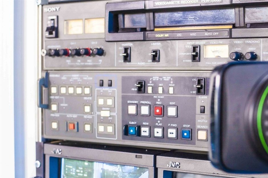 The kit including CANON YJ18X9BIRS & YJ19X9BK12U lenses (Available original Manual). Also, including Sony PVW-2800P Betacam SP Video Cassette Recorder & Editor

The PVW-2800P is a Recorder/Player inheriting the advanced performance of the Betacam SP format, it assures maximum compatibility with the BVW series Betacam SP products and a wide range of their peripheral equipment.It is equipped with a built-in Time Base Corrector and Time Code Generator/Reader. In addition to composite and component video input and outputs, it offers S-Video In/Out connectors, an RS-422A control port and an optional U-Matic Dub Out capability. This comprehensive interfacing makes the PVW-2800P easy to integrate into existing editing systems.

Superior Picture QualityThe adoption of the world standard Betacam SP recording format results in the superior picture quality of the PVW-2800P. This format uses the component recording, in which the chrominance signals (R-Y, B-Y) are time compressed and recorded on one track, using the CTDM (Compressed Time Division Multiplex) system originally developed by Sony, while the luminance (Y) signal is recorded on a separate track. Therefore cross colour and cross luminance effects do not exist in this system. This component two-track recording technology is combined with high frequency FM carriers for each track, providing very wide bandwidths for both the luminance and chrominance signals. Thus pictures with detailed luminance and chrominance information can be reproduced. These characteristics create the excellent multi-generation picture performance of the Betacam SP format.

In order to obtain the maximum performance of the Betacam SP format, the PVW-2800P uses metal particle tapes exclusively for recording. Of course, it can play back both metal and oxide tapes and assures the two-way playback compatibility with BVW series Betacam SP VTRs.

High Audio Quality

The PVW-2800P provides two longitudinal audio channels. Thanks to the tape speed of the format and the adoption of the proven DolbyTM C-type NR (Noise Reduction), the PVW-2800P offers high quality audio with a wide dynamic range even at high frequencies, minimum distortion and excellent S/N ratio.

Longer Operating Time

The PVW-2800P accepts both L-size and S-size cassettes, giving operating times of over 100 minutes and over 35 minutes respectively.

Both grades of Sony Betacam SP videocassettes, the BCT series and the SBT series, can be used in the PVW-2800P. For the highest possible performance, the BCT series is recommended.

Compact and Lightweight

Compactness and lightweight are key factors designed into the PVW-2800P, which weighs approximately 25kg (55 lb 2 oz), and is 5 units high (19-inch rack mountable). The power consumption is 150 W.

VTR to VTR Comprehensive Editing Facility

The PVW-2800P provides a comprehensive, built-in VTR to VTR editing facility.

In addition to the insert and assemble edit functions, which are equipped with auto preview / review, the PVW-2800P also provides an audio split editing capability with independent IN and OUT memories. The PVW-2800P meets the requirements of a modern editing system, having frame-by-frame editing point trim, selectable pre-roll time and auto edit in/out functions, delivering frame accurate editing without any additional control hardware.

With its DMC (Dynamic Motion Control) editing function, the PVW-2800P can perform slow motion editing, when a DTTM equipped VTR, such as the BVW-65P or BVW-75P, with RS-422A communication is used as the player VTR.

Built-in Time Base Corrector

The PVW-2800P is provided with a built-in TBC (Time Base Corrector) as standard. A superior quality output video is obtained directly from the PVW-2800P, with no additional time base correction required. Advanced high quality digital dropout compensation also ensures consistent picture performance.

TBC Remote Control

In addition to the built-in TBC adjustment of the PVW-2800P, remote adjustments may be performed using the optional BVR-50P connected via the D-sub 15-pin cable to the rear panel connector (TBC REMOTE).

Built-in Time Code Generator / Reader

The generation and reading of both VITC (Vertical Interval Time Code) and LTC (Longitudinal Time Code) to the EBU format, together with user bits, come as standard in the PVW-2800P, LTC can be automatically recorded on the dedicated time code track. Time code or user bits settings can be easily executed using the HOLD/SET button and the search dial located on the control panel. External / internal time code, REGEN / PRESET or REC-RUN / FREE-RUN selections are available on the subcontrol panel.

Character Display

The PVW-2800P is provided with a built-in character generator and characters can be superimposed on the signals from Video Output 3 or the Monitor Output. It displays time code generator/reader data (VITC/LTC/U-BIT) and CTL timer data. VTR function status, including shuttle tape speed, can also be displayed by accessing the setup menu. Furthermore, error number and status can be automatically displayed when the error is detected. Character display is On/Off switchable from the subcontrol panel. When the PVW-2800P is operated under the setup menu mode, the initial setup menu is automatically displayed from the character generator.

High Speed Picture Search

By using the search dial incorporated in the PVW-2800P, picture search can be made at various speeds over a range of up to 24 times normal speed in forward and reverse. A recognizable colour picture can be obtained at up to ten times (24 times in monochrome) normal speed in forward and reverse. In the jog mode, tape movement accurately follows the rotation of the search dial in both directions.

Versatile System Interface

RS-422A serial interface (9-pin)
An RS-422A serial interface is provided for versatile editing system expansion and flexible system control. The PVW-2800P will interface with other RS-422A equipped Sony machines.
Y/R-Y/B-Y Component Video Signal Input / Output
The PVW-2800P provides two types of connectors for both Y/R-Y/B-Y component signal input and output: two sets of three BNC connectors or a Betacam 12-pin DUB connector. This component signal interface facility allows full advantage to be taken of the superb performance of the Betacam SP format.
Composite Video Signal Input / Output
In addition to the component connectors, the PVW-2800P is equipped with the composite video signal input / output connectors. The PVW-2800P employs new digital LSIs for video signal processing, including Y/C separation and decoding, so that the composite video input signals can be decoded faithfully.
U-matic DUB Signal Output
With the optional BKW-2030 U-matic DUB Out Kit installed, the PVW-2800P can transfer Betacam SP material to a U-matic VTR through its 7-pin U-matic DUB output connector with minimum picture degradation. This transfer is made without being affected by the performance of the Y/C separator in the U--matic VTR.
S-video Signal Input / Output
S-video signal input/output connectors are also provided so that other equipment with S-video connectors can easily be interfaced to the PVW-2800P.
User Friendly Dial Menu Operation

In order to meet various customised operations, the PVW-2800P is provided with an initial setup menu which has easy accessibility and simple operation. This initial setup menu allows many operational parameters to be preset for operator convenience. The initial setup menu is scrolled and modified by the search dial while monitoring Video Output 3, Monitor out, or the LED Timer display. The modified menu is memorised in a non-volatile memory.

Improved Serviceability

For easy maintenance and servicing, the PVW-2800P is provided with comprehensive self-diagnostics. A digital hour meter is also fitted to indicate the accumulated times of power on, drum rotation and tape running. It can also display the number of threading/unthreading operations.

Detachable Control Panel

The control panel of the PVW-2800P can be tilted at up to 90 degrees. Alternatively, the control panel can be removed from the machine to provide remote control from a distance of up to 5m by using the optional BKW-2010 Control Panel Extension Kit and BK-803 Control Panel Case.

19-inch EIA Standard Rack Mountable

With the optional RMM-100, the PVW-2800P can be mounted into a 19-inch EIA standard rack without taking off the side panel.